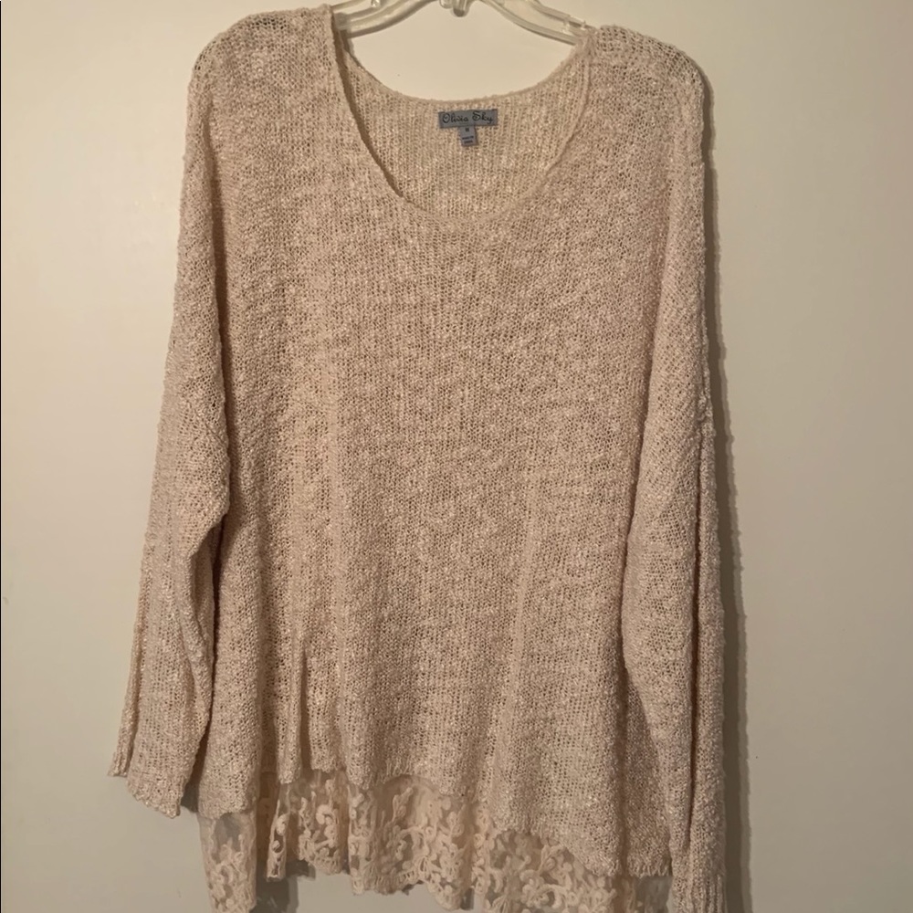 Pretty sweater with lace bottom.